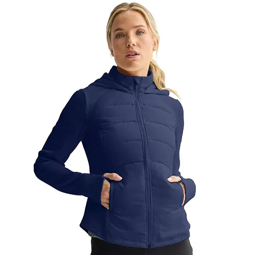 A woman is wearing a navy blue zip-up jacket with a hood and front pockets.