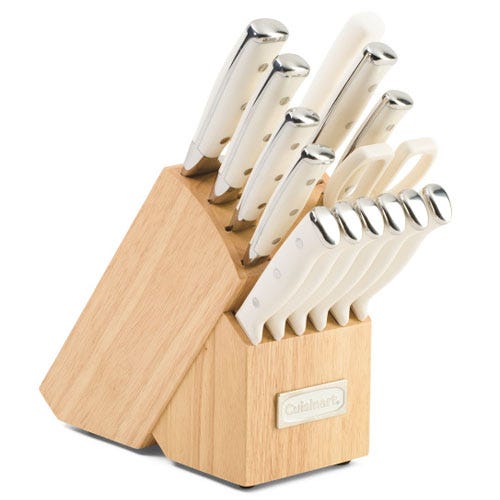 A 15-piece Cuisinart knife block set with white handles is shown, including various knives, kitchen shears, and a sharpener. The block is wooden with a Cuisinart logo.