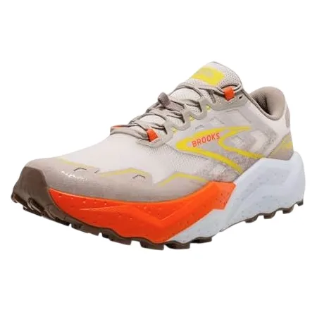 A beige and orange trail running shoe by Brooks, featuring a rugged sole and dynamic design suitable for outdoor activities.