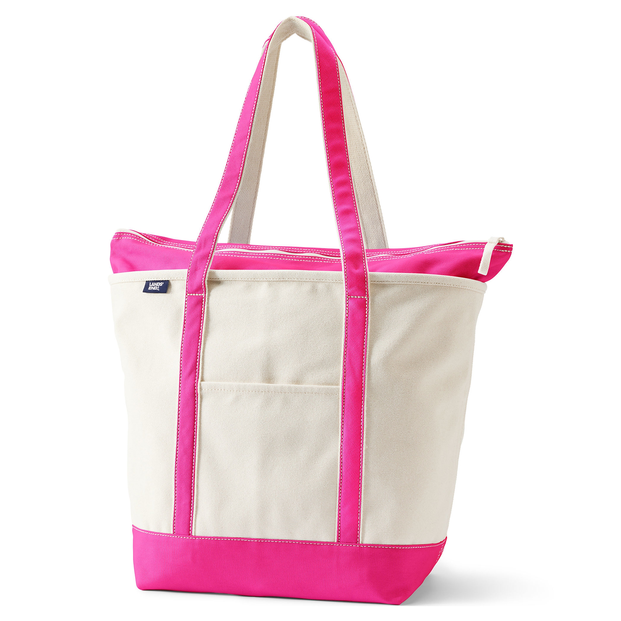A large Lands' End canvas tote with a natural body and bright pink accents, including handles and bottom. It features a front pocket and a zipper closure, ideal for carrying various items.