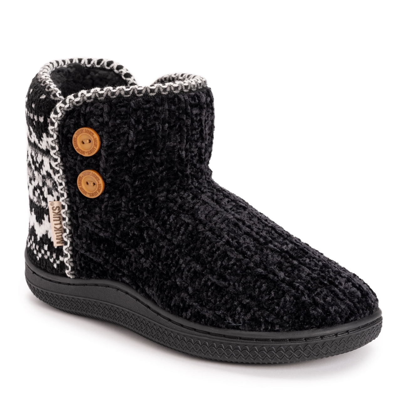 Knitted black and white ankle boot with buttons on the side and a black rubber sole.