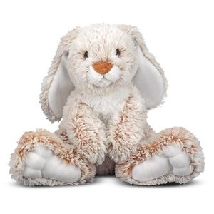 A plush Melissa & Doug bunny with long floppy ears, tan and white fur, and an orange nose, in a seated position.