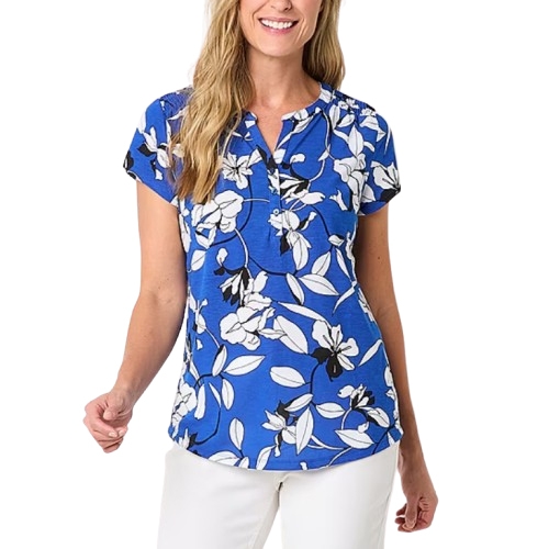 Blue short sleeve blouse with a white and black floral pattern, featuring a notch neckline and slightly curved hem, paired with white pants.