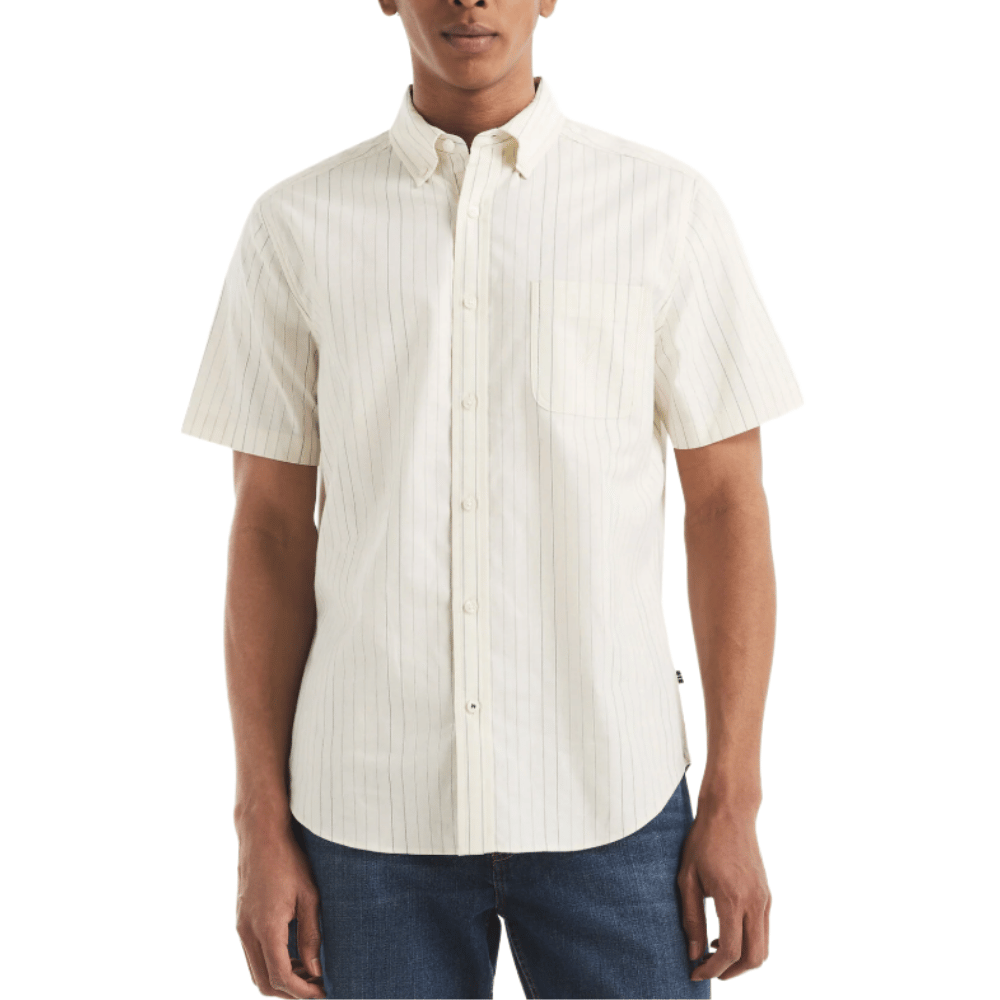 Short-sleeve, button-up shirt with a subtle pinstripe pattern, featuring a chest pocket and a slightly curved hem. Paired with blue denim jeans.