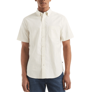 Short-sleeve, button-up shirt with a subtle pinstripe pattern, featuring a chest pocket and a slightly curved hem. Paired with blue denim jeans.