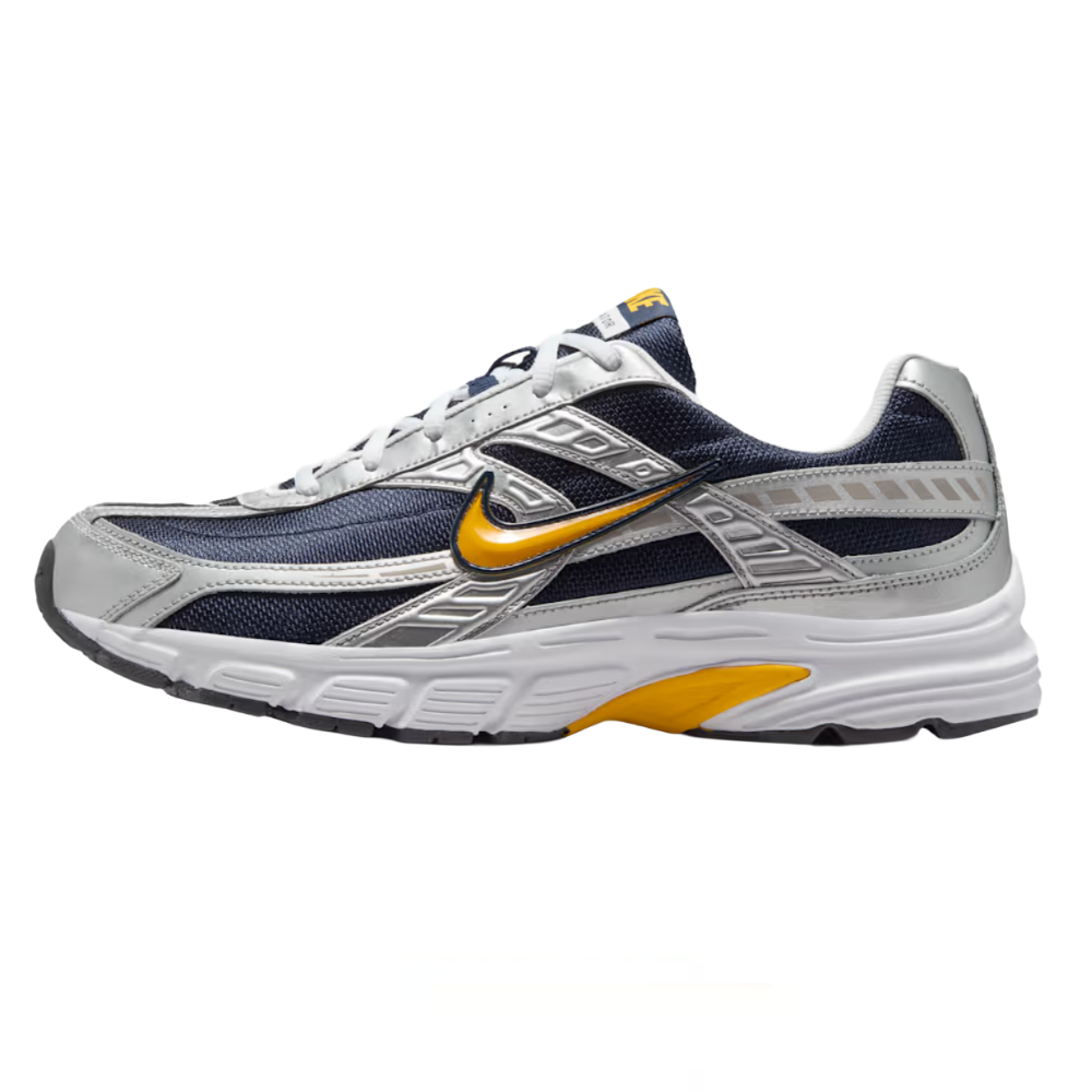 Athletic shoe with a blue and silver mesh design, featuring a yellow swoosh logo and a white, textured sole.