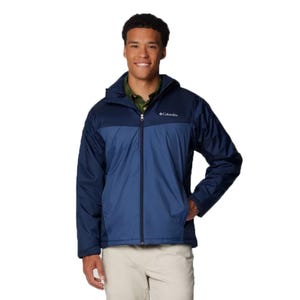 The Columbia Glennaker Sherpa Jacket is a men's blue zip-up jacket featuring a hood, lightweight design, and a plush, warm Sherpa lining for added comfort and insulation.