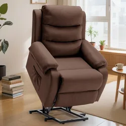 Brown lift recliner chair with a side pocket, set in a living room with a wooden floor, books, plants, and a coffee table.