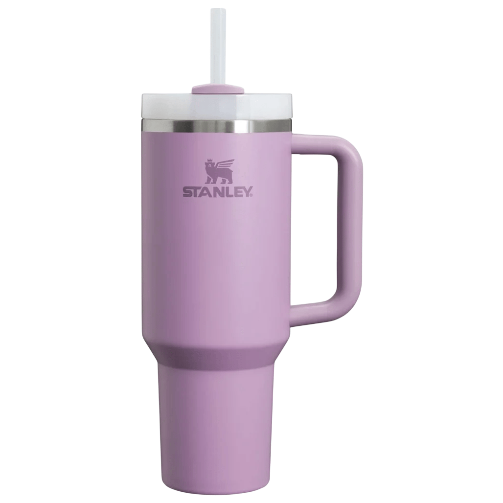 A light purple Stanley cup with a handle and straw, featuring a stainless steel rim and branded logo.