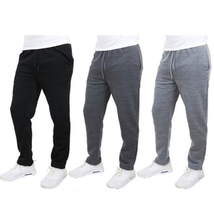 Three pairs of jogger pants in black, dark gray, and light gray, worn with white sneakers.