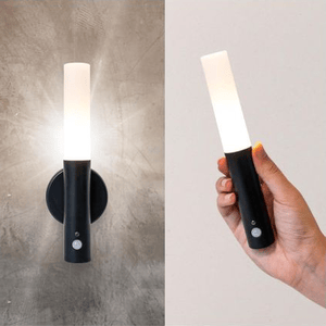 A wall-mounted LED light with a detachable, handheld flashlight component, featuring a sleek black and white design.