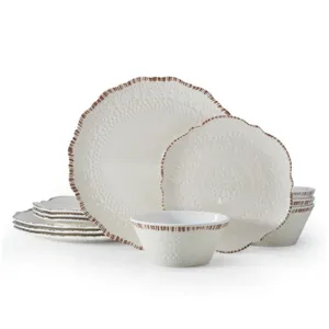 A 16-piece embossed ceramic dinnerware set with a white lace pattern and brown edges, including dinner plates, salad plates, and bowls.