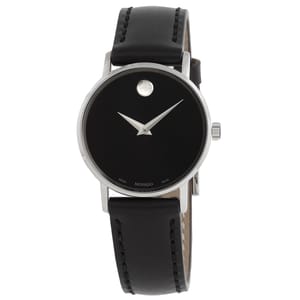 Women's Movado watch with a black dial, minimalist design featuring a single silver dot at 12 o’clock, silver hands, and a black leather strap. The case is stainless steel.