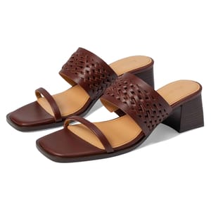 Brown woven leather sandals with a square toe and block heel. They feature two straps, a wider woven one over the front and a narrow toe strap, providing a stylish and structured design.