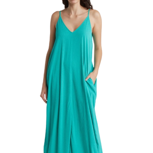 Teal gauze maxi dress with adjustable spaghetti straps, V-neckline, and relaxed fit, featuring side pockets for convenience. Ideal for a casual, breezy look.