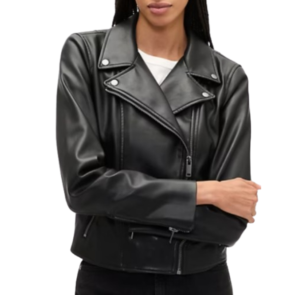 A black faux leather biker jacket with a classic asymmetrical zipper, snap-button lapels, and zippered pockets. Worn over a white shirt with black pants.