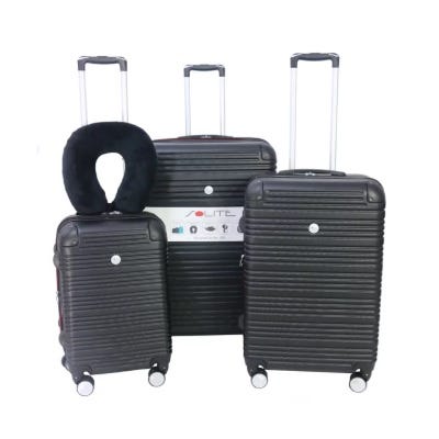 Three black suitcases of varying sizes with telescopic handles and swivel wheels are shown, along with a black neck pillow draped over one of them.