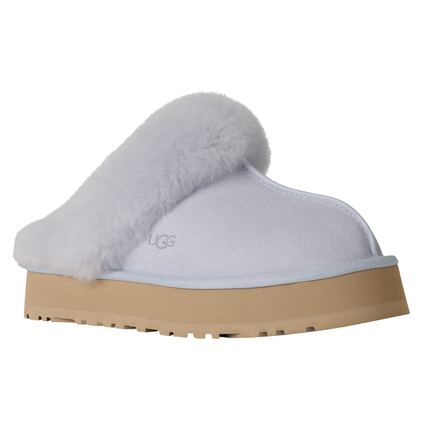 A white UGG slipper with a fluffy trim, featuring a thick beige sole and the UGG logo embossed on the side.
