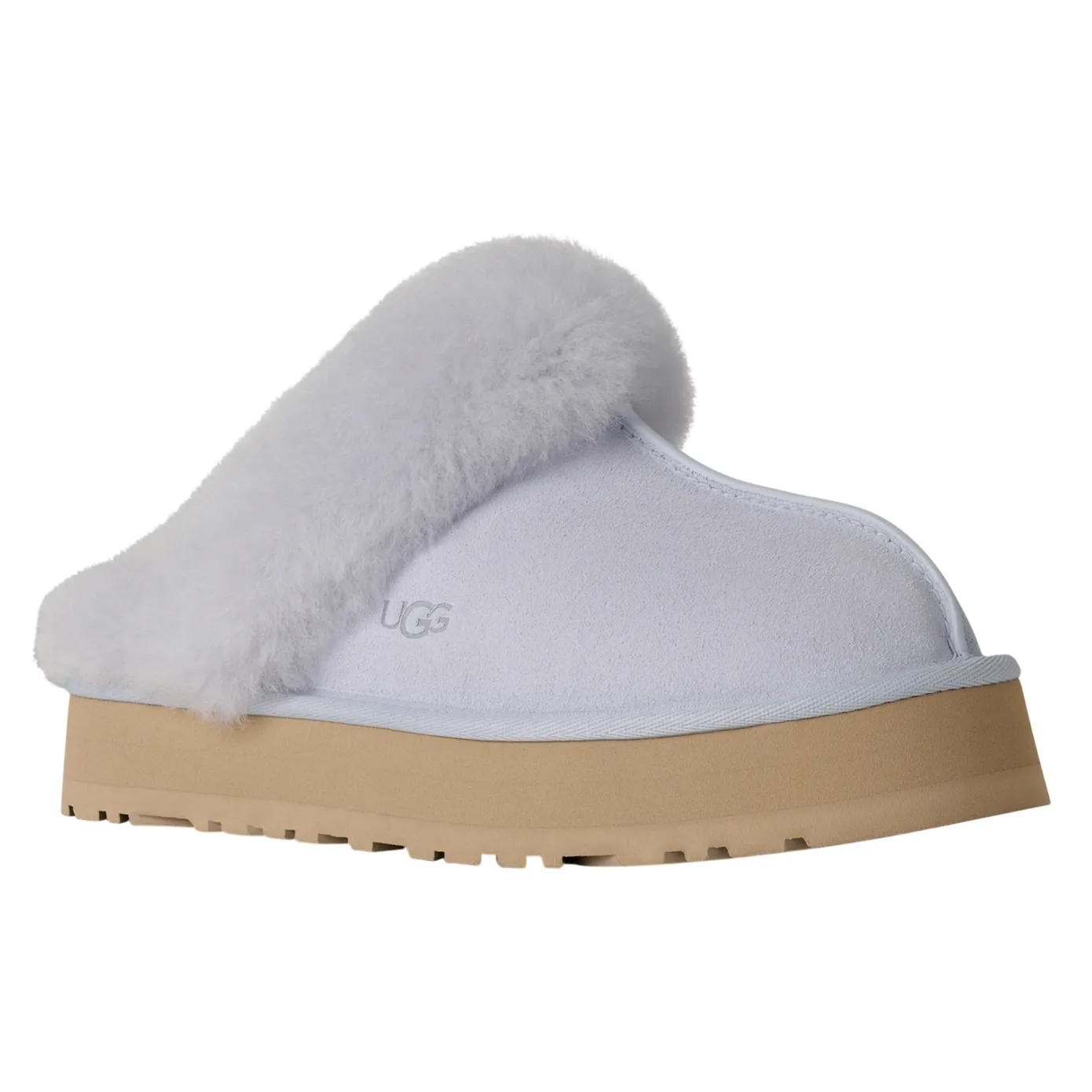 A white UGG slipper with a fluffy trim, featuring a thick beige sole and the UGG logo embossed on the side.