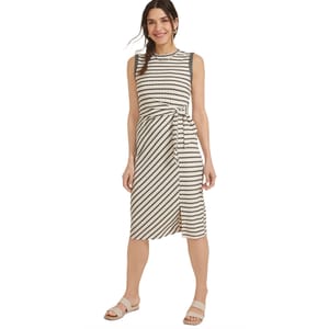 Sleeveless striped dress with a waist tie, featuring a knee-length hem and side slit, paired with flat sandals.