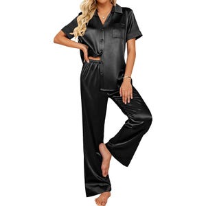 Black satin pajama set with short sleeves and long pants.