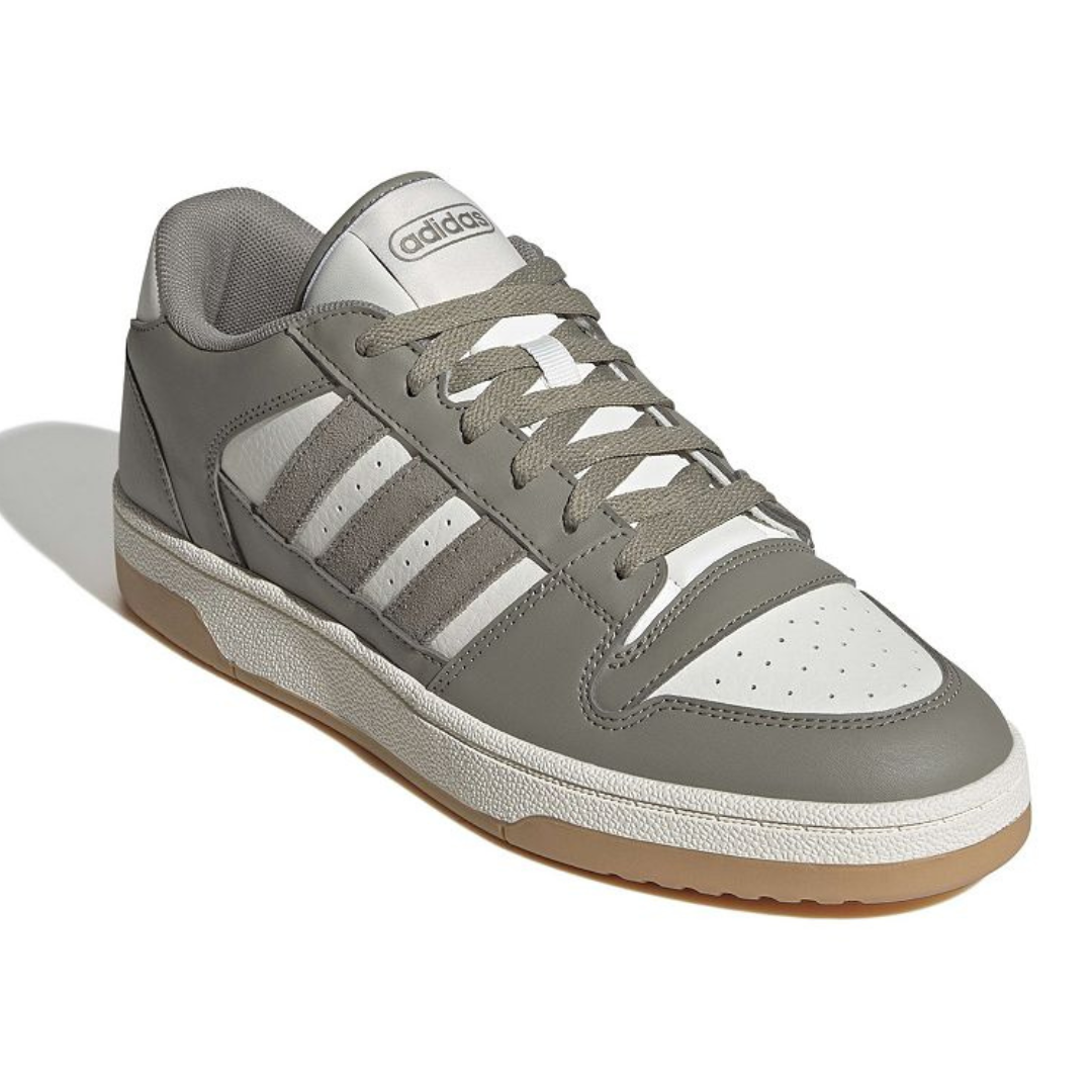 Gray and white Adidas Men's Break Start shoes featuring synthetic leather, a lace-up design, the signature three stripes, and a gum rubber sole for classic sneaker style.