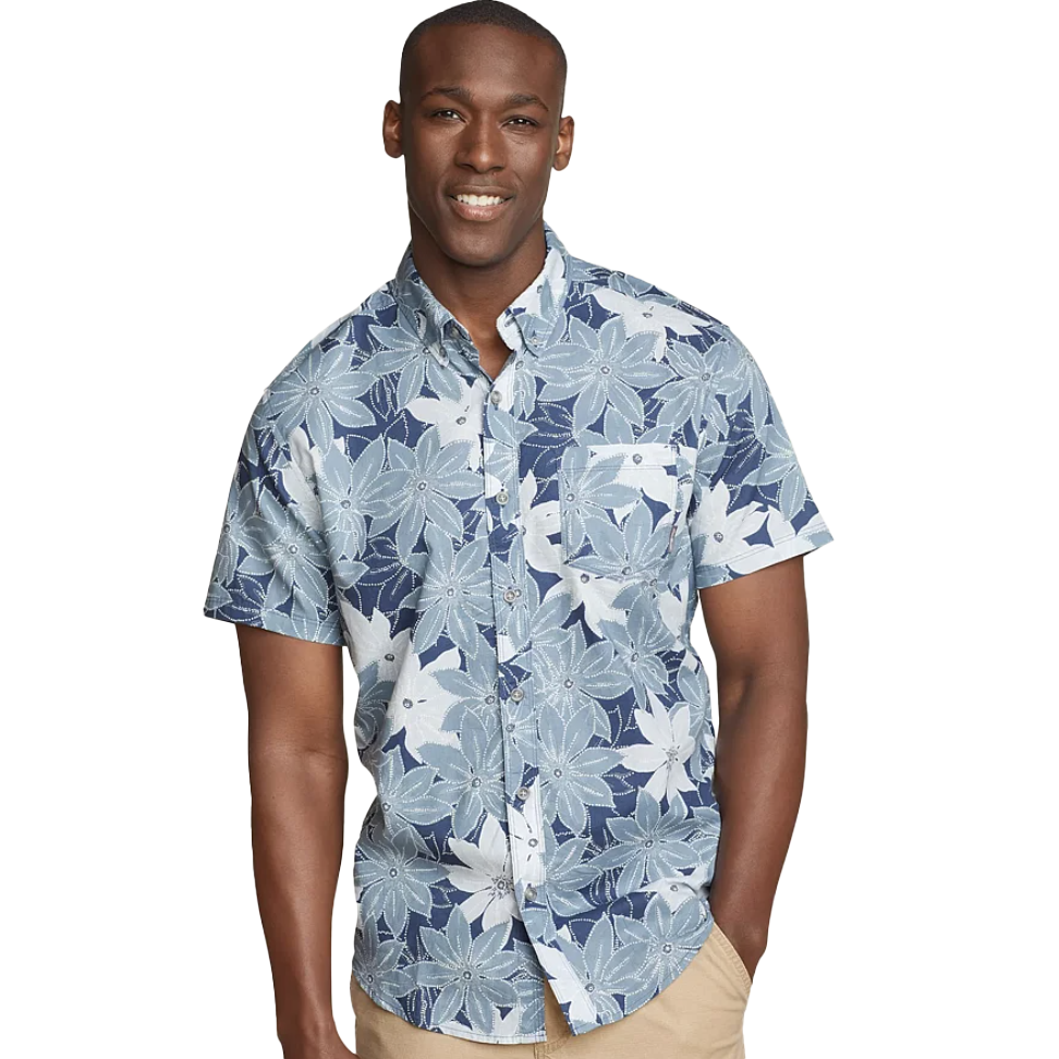 Eddie Bauer Baja Printed Shirt features a blue and white floral pattern with short sleeves, a button-up design, and a chest pocket, offering a casual, tropical style.
