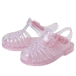 Children's pink glittery jelly sandals with a buckle strap and open-toe design.