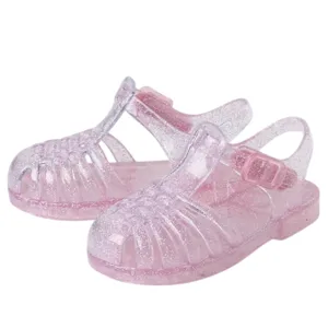 Children's pink glittery jelly sandals with a buckle strap and open-toe design.
