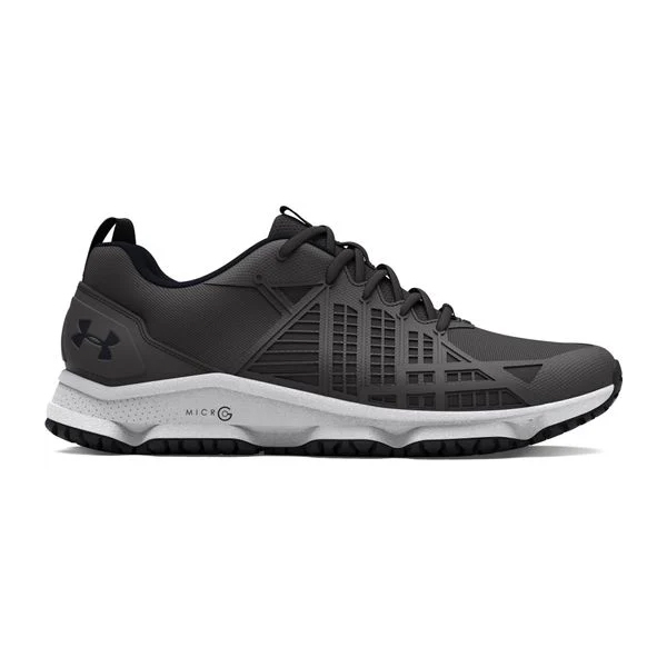Black Under Armour Micro G tactical shoes with a white sole, featuring the brand's logo on the side and a reinforced design for durability.