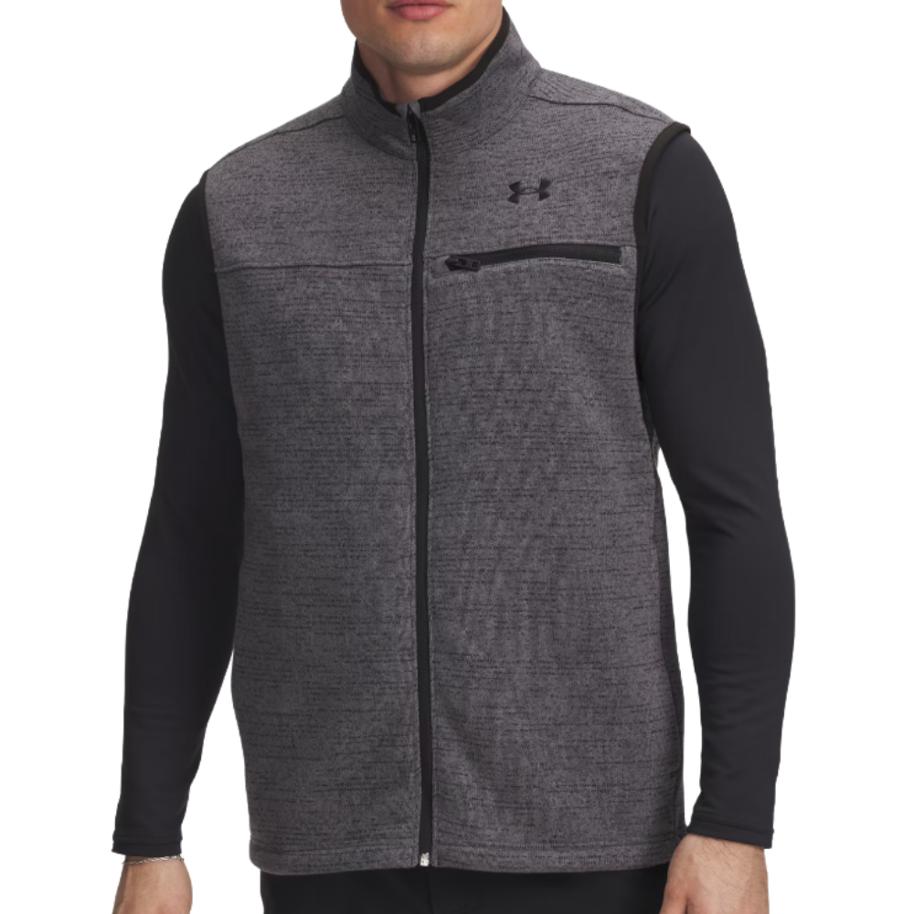 A gray zip-up vest with a high collar and a small chest pocket, featuring a black logo on the upper chest, worn over a black long-sleeve shirt.