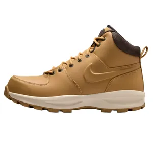A tan high-top Nike boot with a padded collar, leather upper, and rugged sole, featuring a visible Nike logo.