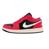 A red and black Nike Air Jordan 1 Low sneaker featuring a white swoosh and a beige sole, with a perforated toe box and signature branding on the heel.