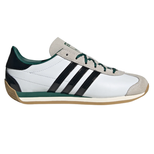 White and green athletic shoe with three black stripes, suede details, and a gum sole.