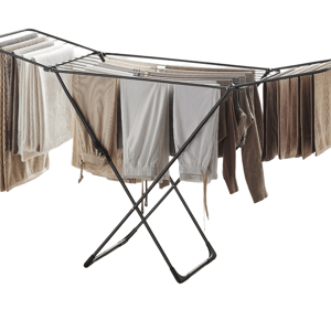 A black collapsible drying rack holds beige and brown clothing.