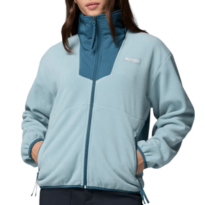 Light blue fleece jacket with zip closure, featuring a higher collar and discreet logo on the chest.