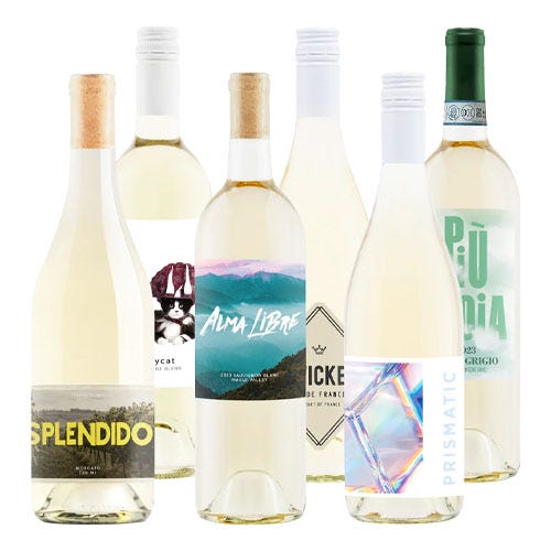 A selection of six white wine bottles with various labels, including names like Splendido, Alma Libre, and Prismatic, featuring different designs and themes.