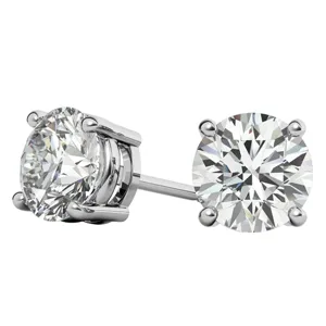 A pair of round diamond stud earrings set in a four-prong white gold setting.
