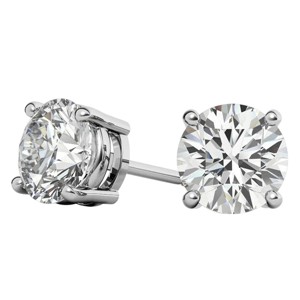 A pair of round diamond stud earrings set in a four-prong white gold setting.