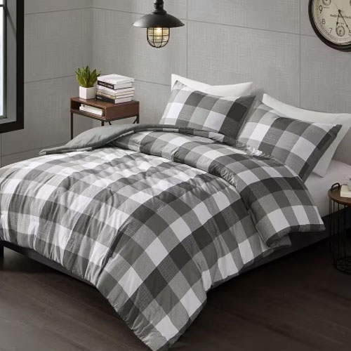 A queen-sized comforter set featuring a large gray and white checkered pattern, including two matching pillow shams.