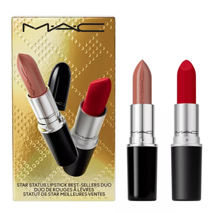 A MAC Star Status Lipstick set features two shades: a nude and a classic red, packaged in sleek black tubes with silver accents, presented in a gold box.