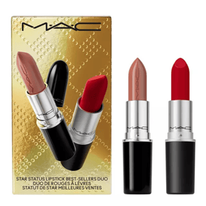 A MAC Star Status Lipstick set features two shades: a nude and a classic red, packaged in sleek black tubes with silver accents, presented in a gold box.