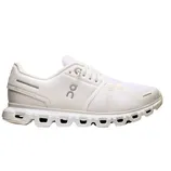 White athletic shoe with a mesh upper, distinctive cushioning, and a unique sole design featuring cut-out sections.