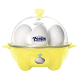 A yellow egg cooker with a transparent lid contains three eggs, one branded with the \“Peeps\“ logo.
