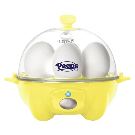 A yellow egg cooker with a transparent lid contains three eggs, one branded with the \“Peeps\“ logo.