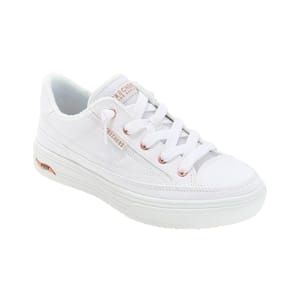 White low-top sneaker with rose gold accents and thick white sole, featuring lace-up closure.