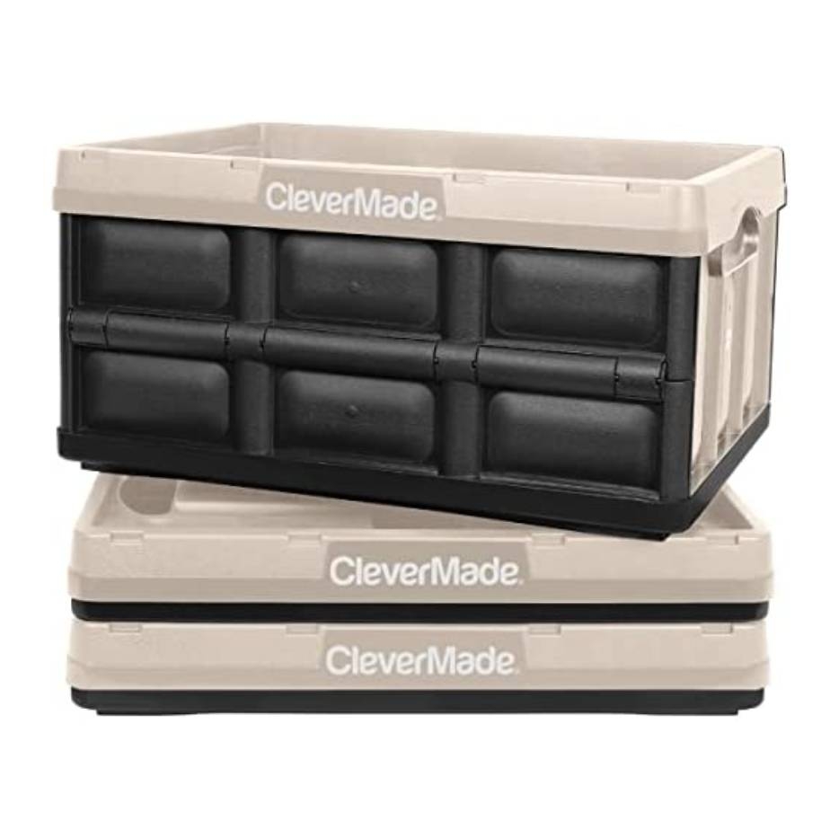 Stackable CleverMade crates, one open on top of two closed, beige with black interior, designed for storage and organization.