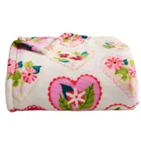 A soft blanket with a floral and heart pattern in pink, green, and blue on a white background.