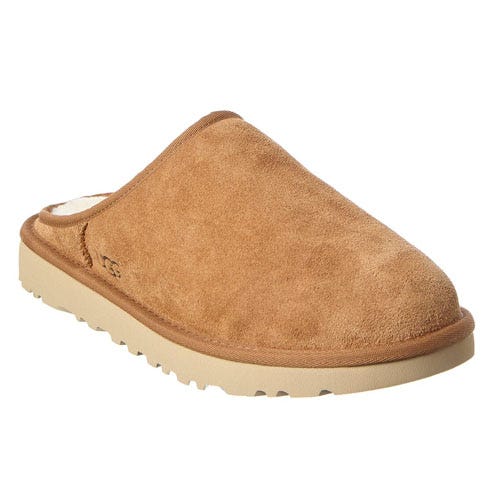 A brown slip-on suede slipper with a plush lining and ribbed rubber sole, featuring a low-profile design and a cozy, casual appearance.