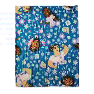 A blue beach towel with floral patterns and cartoon character prints.